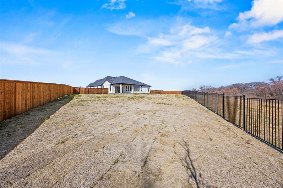 Backs to greenbelt. 1/2 Acre lot