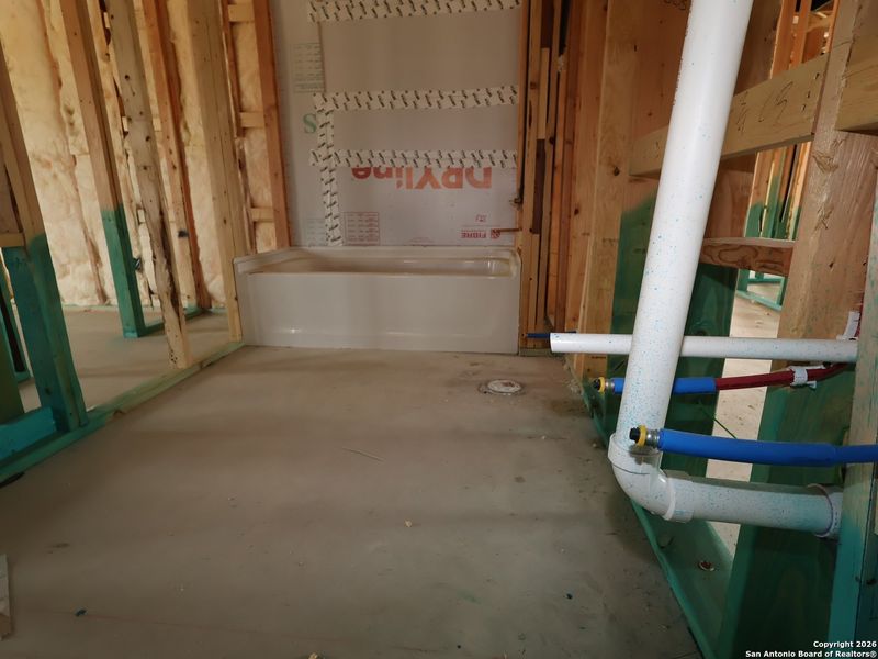 In-progress construction of a new home in Chaparral Ranch, Floresville, TX (Image 22).