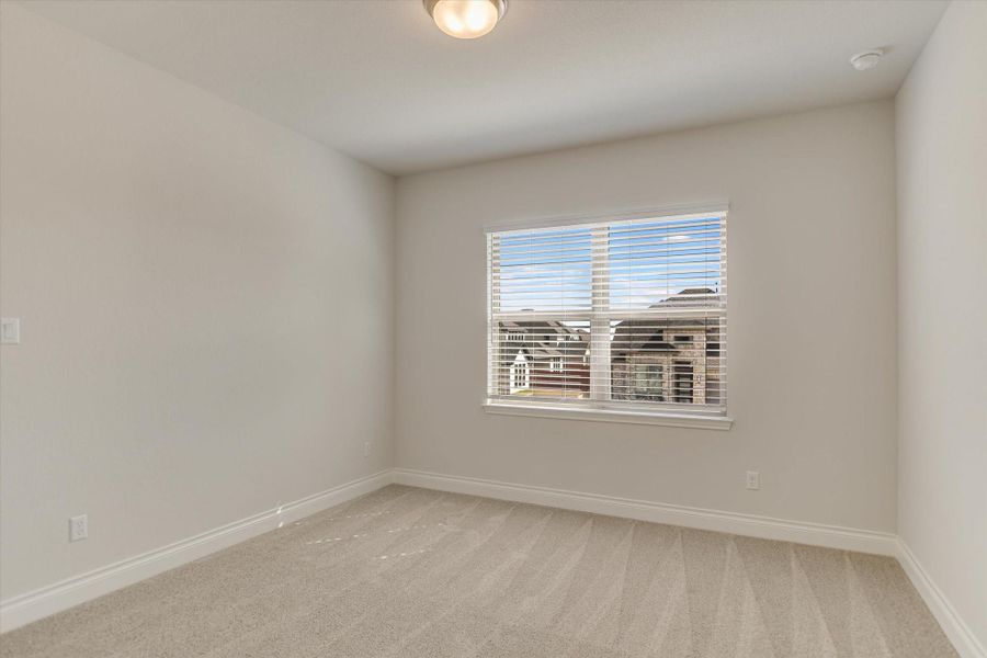 Secondary bedroom located on the first level.