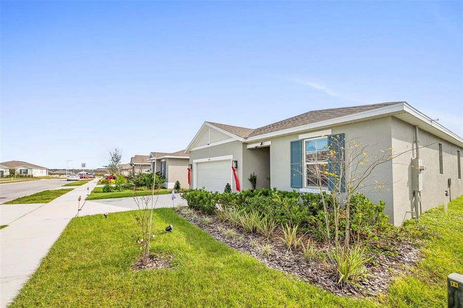 Front exterior of a new home in , Lake Wales, FL, highlighting curb appeal (Image 2). Front exterior of a new home in , Lake Wales, FL, highlighting curb appeal (Image 2).