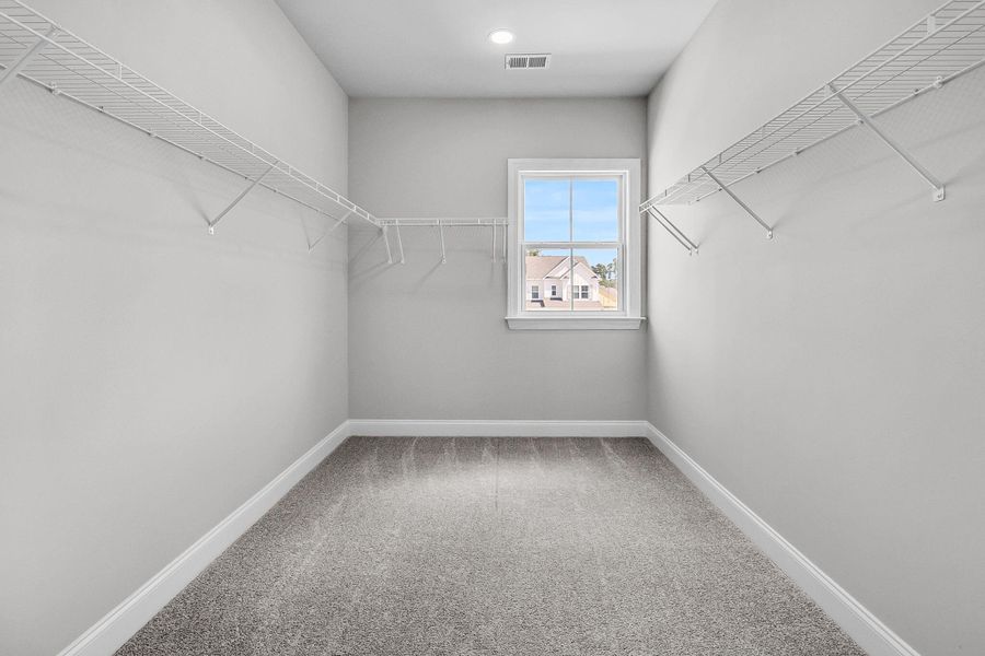 Spacious, unfurnished interior of a new home in Tidewater at Lakes of Cane Bay, Summerville (Image 29).