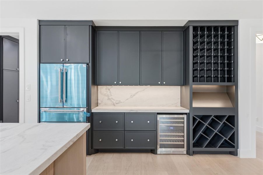 The heart of the home, this stunning kitchen showcases a spacious oversized island, premium finishes, and exceptional functionality.