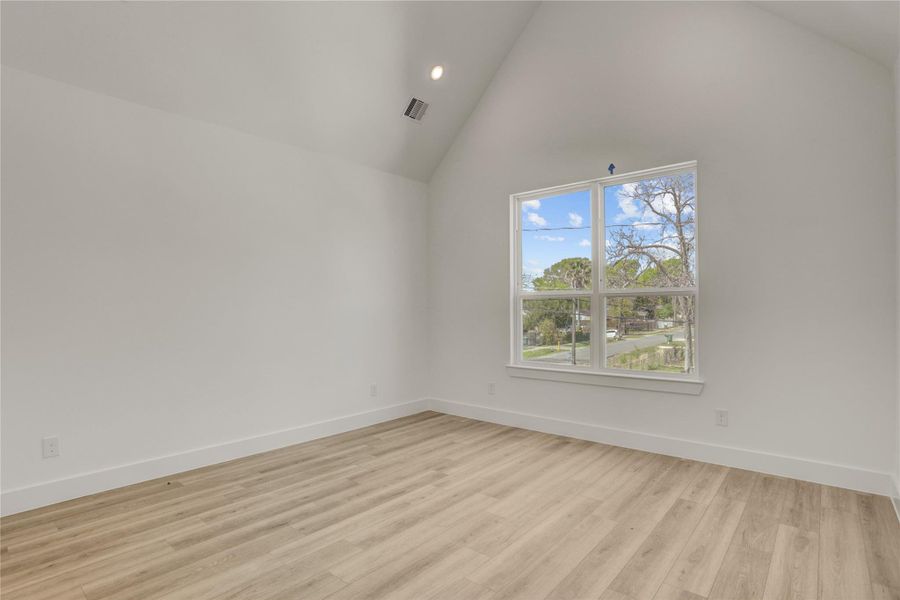 The 13x13 SF primary bedroom has a cathedral ceiling.