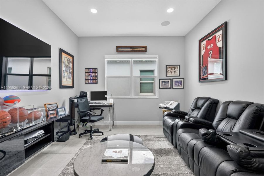 Versatile space with built-in surround sound—perfect for a home theater, office, or entertaining.