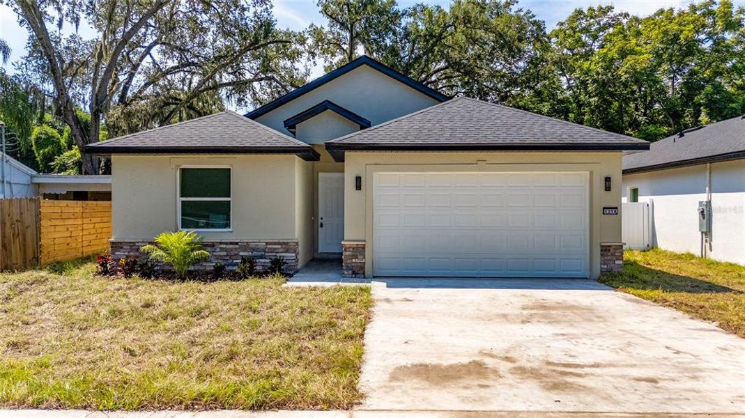 Front exterior of a new home in , Orlando, FL, highlighting curb appeal (Image 1).