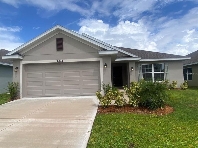 Front exterior of a new home in , Harmony, FL, highlighting curb appeal (Image 2). Front exterior of a new home in , Harmony, FL, highlighting curb appeal (Image 2).