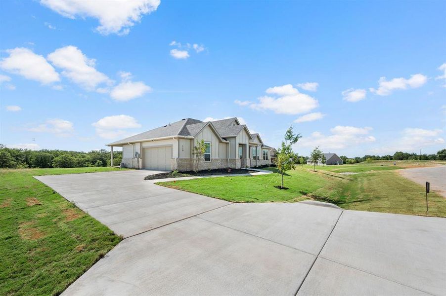 Front exterior of a new home in Saddleback Estates, Boyd, TX, highlighting curb appeal (Image 19).