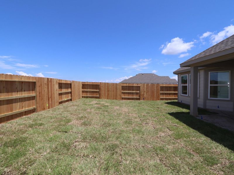 Front exterior of a new home in Lago Mar, Santa Fe, TX, highlighting curb appeal (Image 18). Front exterior of a new home in Lago Mar, Santa Fe, TX, highlighting curb appeal (Image 18).