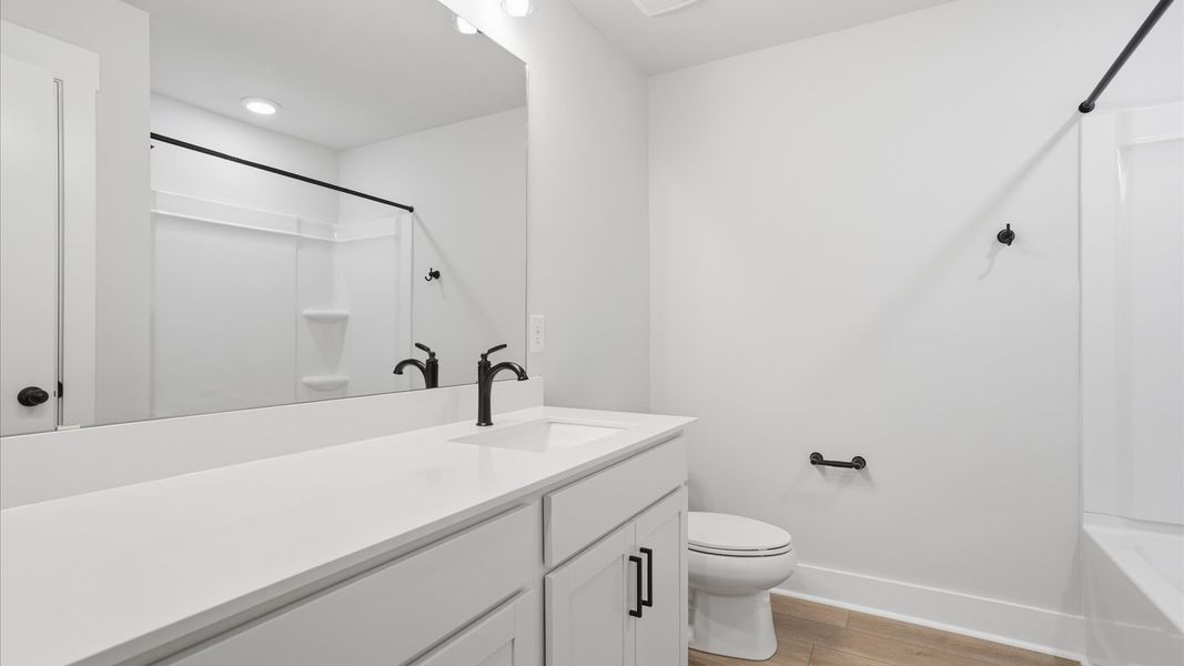 Accomplished bathroom design with sleek tile, high-quality cabinetry, and refined hardware at Silo Ridge Accomplished bathroom design with sleek tile, high-quality cabinetry, and refined hardware at Silo Ridge