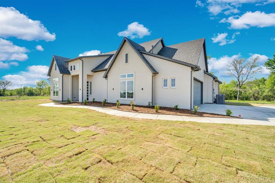 Front exterior of a new home in , Corsicana, TX, highlighting curb appeal (Image 2). Front exterior of a new home in , Corsicana, TX, highlighting curb appeal (Image 2).