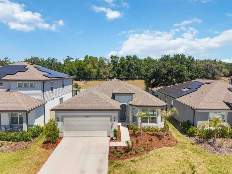 Front exterior of a new home in , Valrico, FL, highlighting curb appeal (Image 2).
