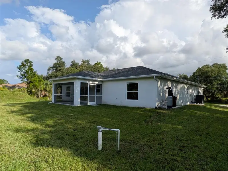 Exterior details and patio area of a home in , North Port (Image 25).