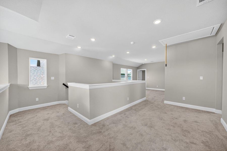 Empty room featuring light carpet, attic access, and recessed lighting Empty room featuring light carpet, attic access, and recessed lighting