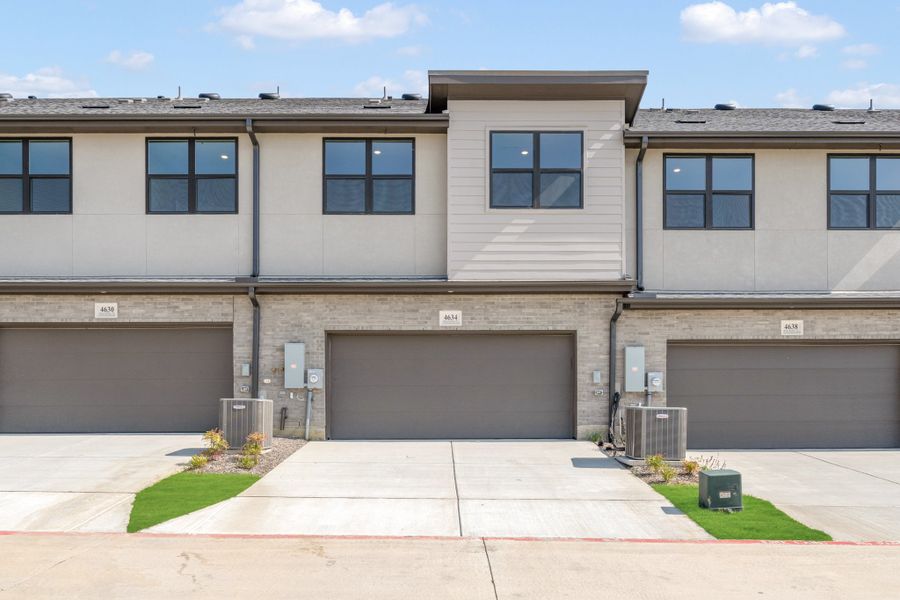 Front exterior of a new home in Wildridge, Oak Point, TX, highlighting curb appeal (Image 28). Front exterior of a new home in Wildridge, Oak Point, TX, highlighting curb appeal (Image 28).