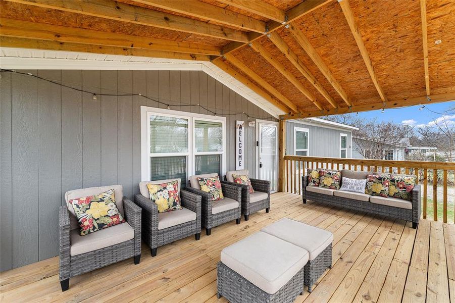 Wooden deck featuring outdoor seating