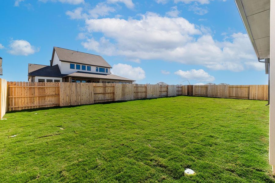 Exterior details and patio area of a home in Lariat - 70', Liberty Hill (Image 2). Exterior details and patio area of a home in Lariat - 70', Liberty Hill (Image 2).