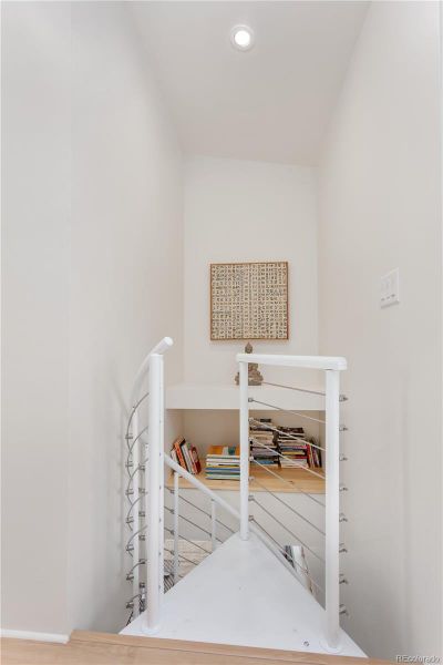 Built-in shelving nook for displays or extra storage.