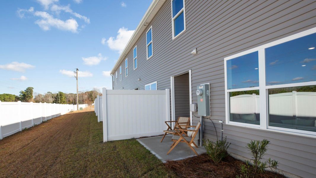 Exterior details and patio area of a home in Waterside Townhomes, Surf City (Image 28).