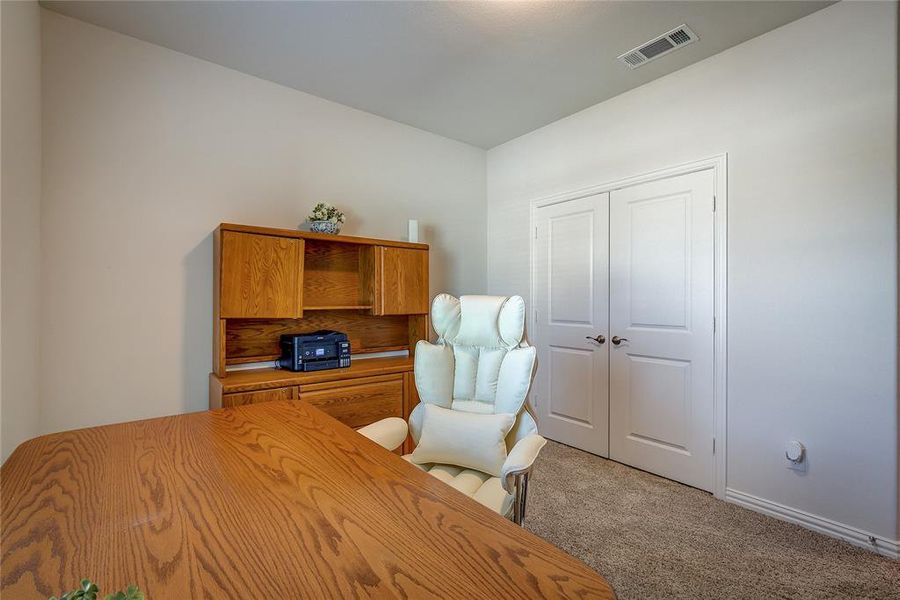 Bedroom featuring a closet and carpet floors