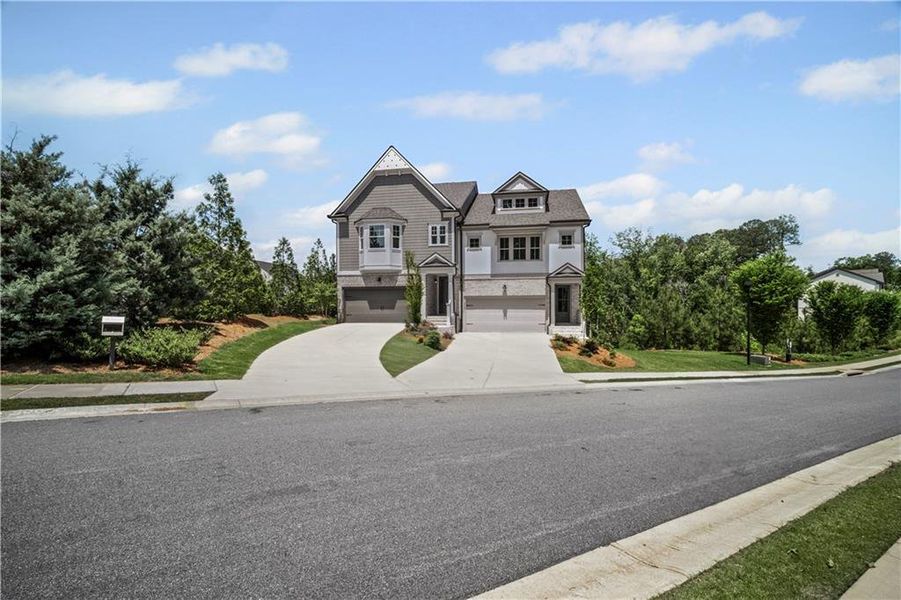 Front exterior of a new home in The Retreat at River Green, Canton, GA, highlighting curb appeal (Image 23).