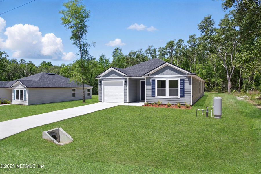 Front exterior of a new home in , Satsuma, FL, highlighting curb appeal (Image 25).