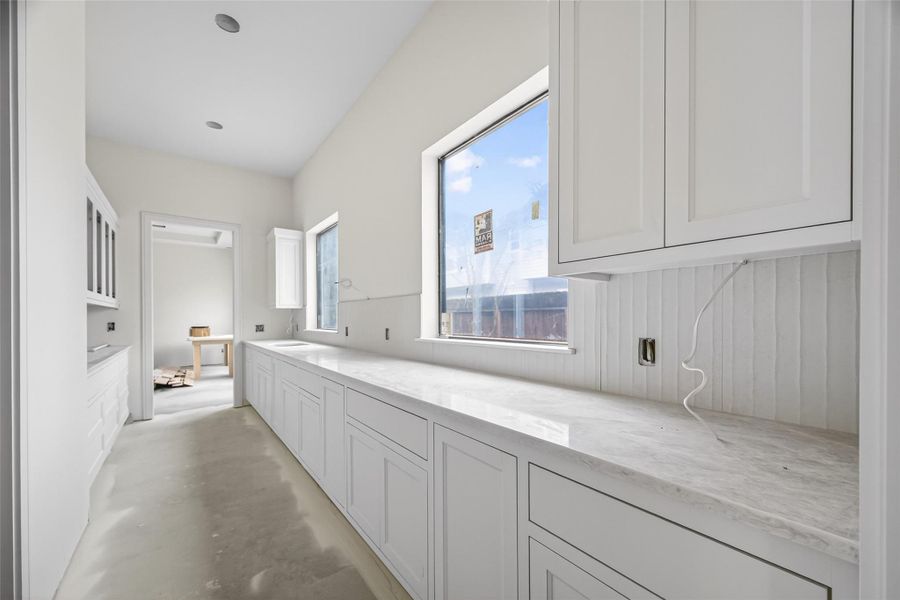 Another secondary large pantry in between the kitchen and dining room