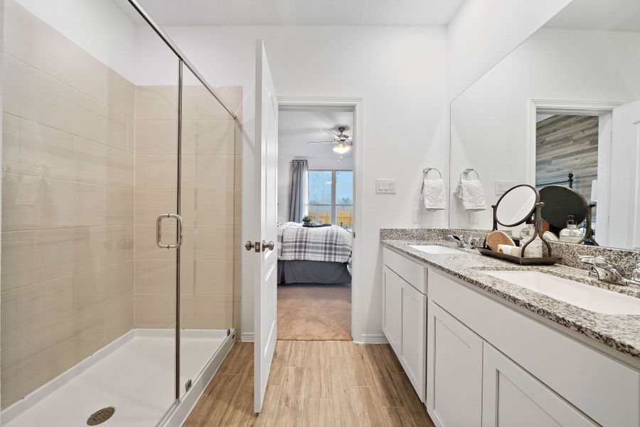 A bathroom with a glass shower. A bathroom with a glass shower.