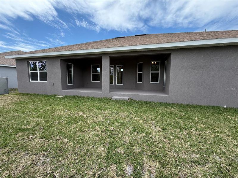 Front exterior of a new home in South Gulf Cove, Port Charlotte, FL, highlighting curb appeal (Image 15).