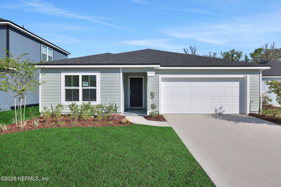 Front exterior of a new home in Wilford Oaks, Orange Park, FL, highlighting curb appeal (Image 24).