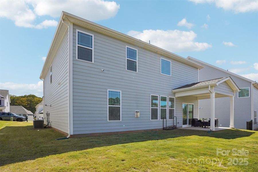 Front exterior of a new home in Falls Cove, Troutman, NC, highlighting curb appeal (Image 1).
