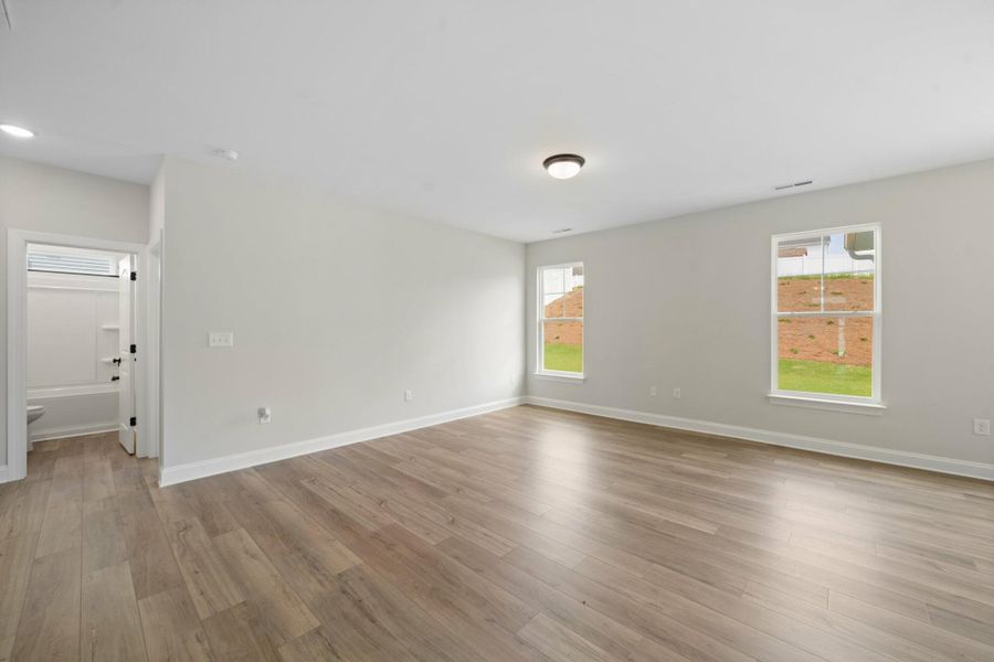 Spacious, unfurnished interior of a new home in Cottages at Piper Village, Trinity (Image 16).