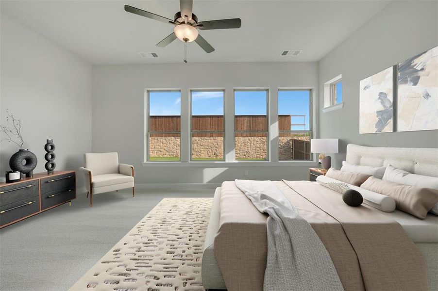 Spacious room featuring light gray carpeting, a ceiling fan with integrated lighting, and multiple windows