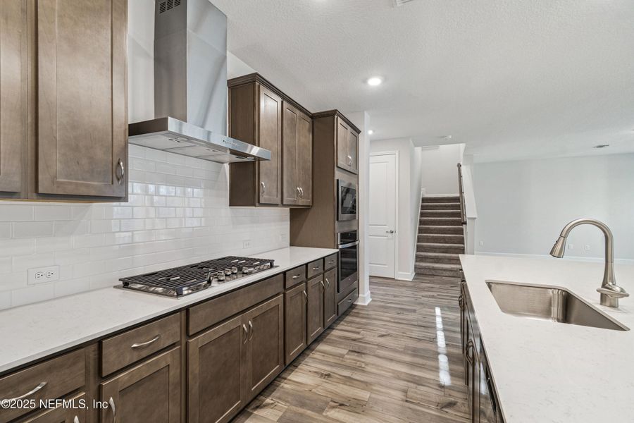 Furnished interior view inside a new home in Tributary 70', Yulee (Image 6).