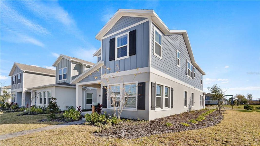 Front exterior of a new home in , Orlando, FL, highlighting curb appeal (Image 23).