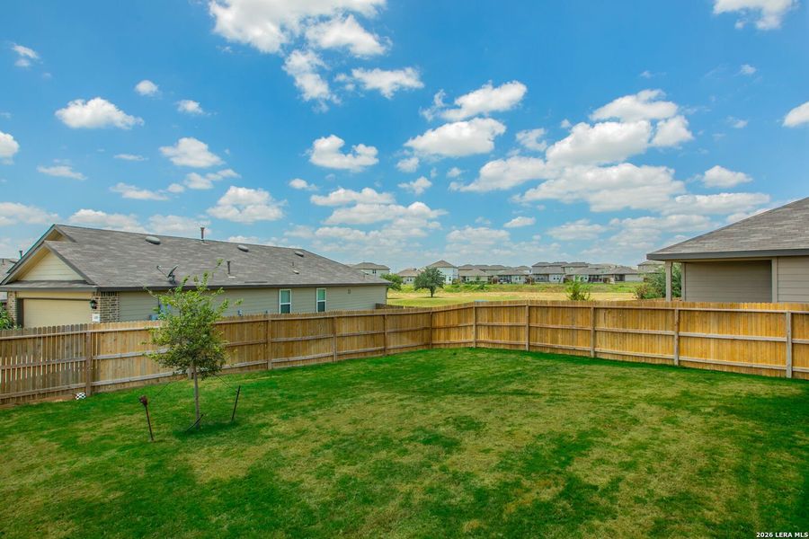 Exterior details and patio area of a home in The Links at River Bend, Floresville (Image 23).
