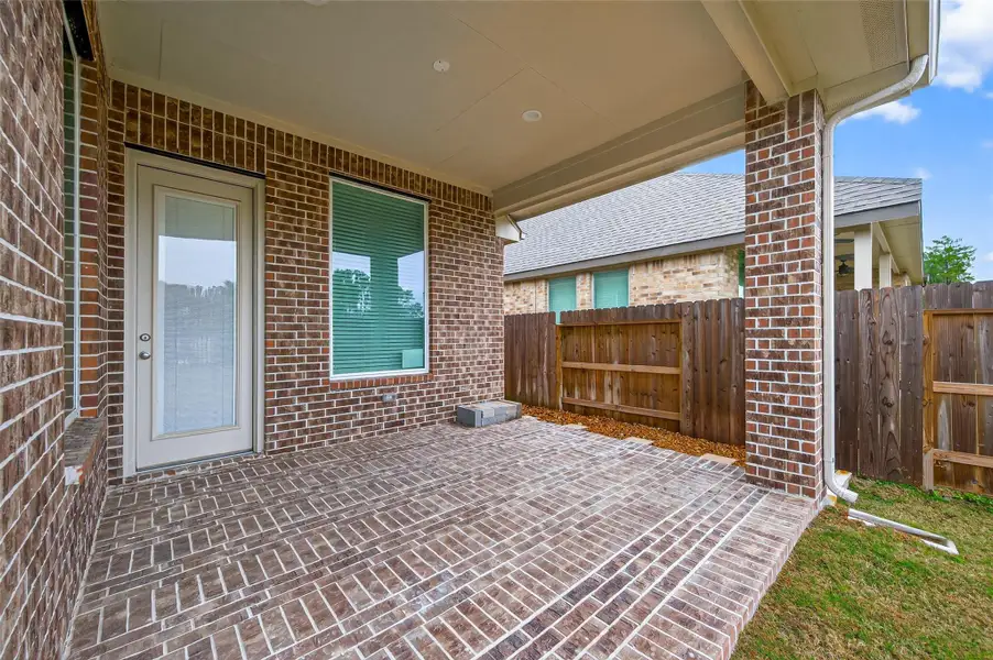 Exterior details and patio area of a home in Artavia, Conroe (Image 4).