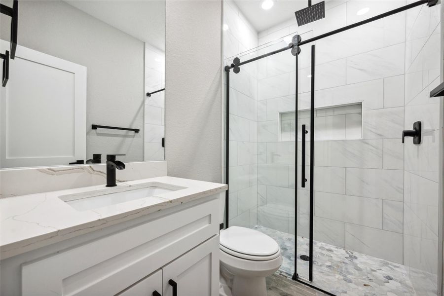 Guest bath with spacious shower.