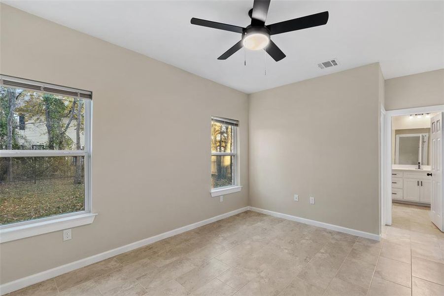 Empty room featuring ceiling fan