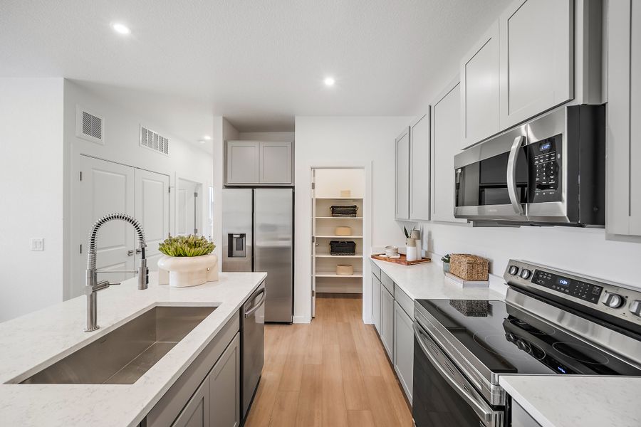 Furnished interior view inside a new home in Lyric at RidgeGate Condos, Lone Tree (Image 6).