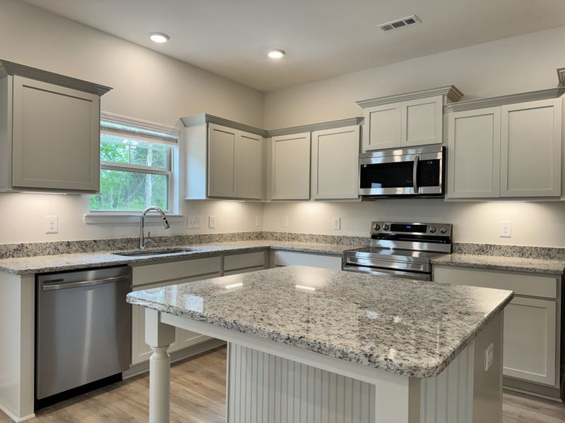 Kitchen.

*Photos are from a staged model home of floor plan. Options and Selections may vary in actual home.