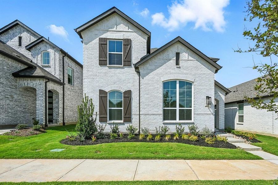 Front exterior of a new home in Pecan Square: 40ft. lots, Northlake, TX, highlighting curb appeal (Image 1). Front exterior of a new home in Pecan Square: 40ft. lots, Northlake, TX, highlighting curb appeal (Image 1).