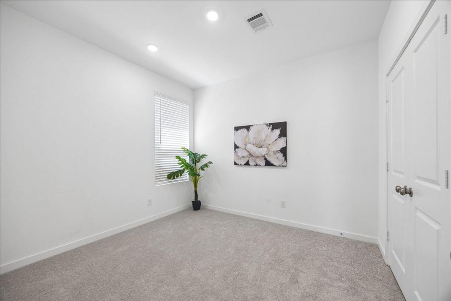 Another comfortable guest bedroom adds even more flexibility, with plush carpet, neutral finishes, a roomy closet and plenty of space to settle in and make it your own.