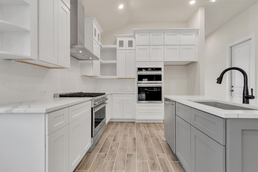 Culinary delights await in this bright kitchen, complete with a generous island and sleek appliances.