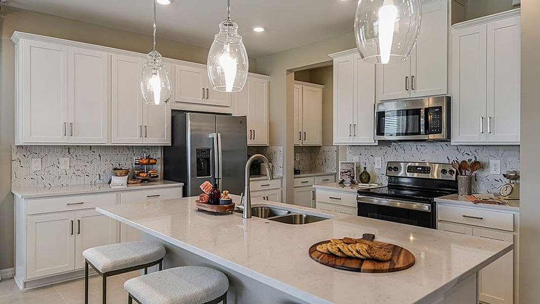 Representative furnished interior of a home built from the Grenada by Taylor Morrison in The Cove at West Port, Port Charlotte (Image 3).