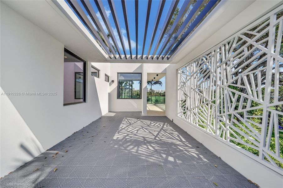 Exterior details and patio area of a home in , Miami Beach (Image 18).