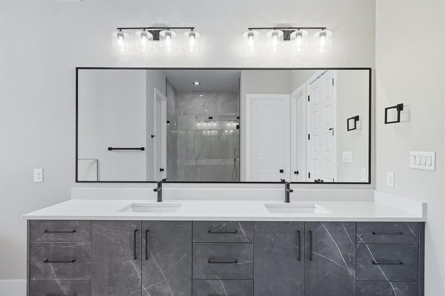 Full bathroom with a shower stall and double vanity Full bathroom with a shower stall and double vanity
