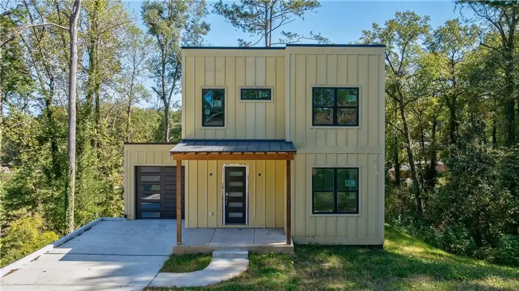 Front exterior of a new home in , Hapeville, GA, highlighting curb appeal (Image 9).