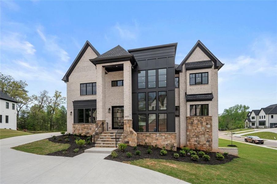 Front exterior of a new home in Timber Rock Manor, Cumming, GA, highlighting curb appeal (Image 32).