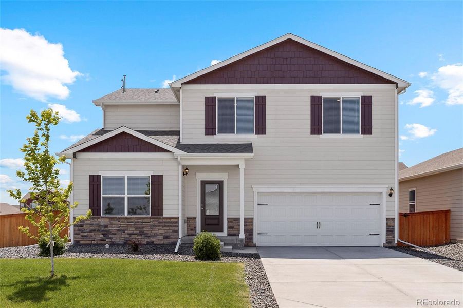 Front exterior of a new home in , Severance, CO, highlighting curb appeal (Image 1).