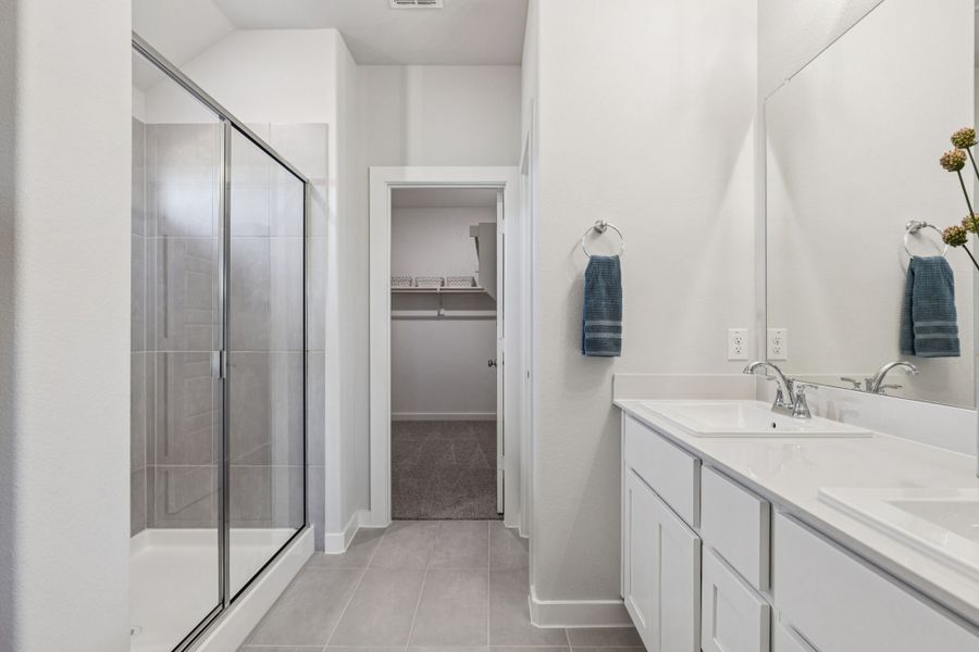Primary Bathroom in the Oscar home plan by Trophy Signature Homes – REPRESENTATIVE PHOTO